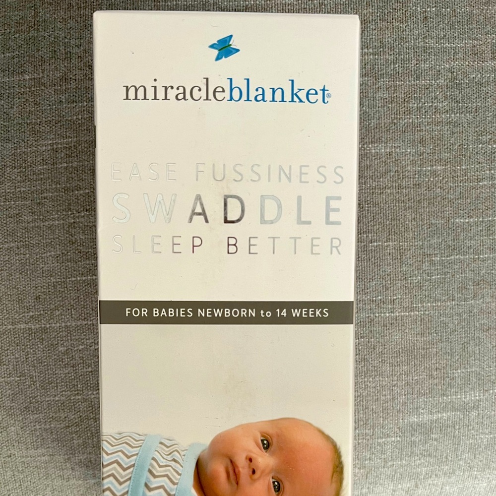 Miracle blanket swaddle NWT.  Newborn - 14 weeks. Aqua stars pattern.